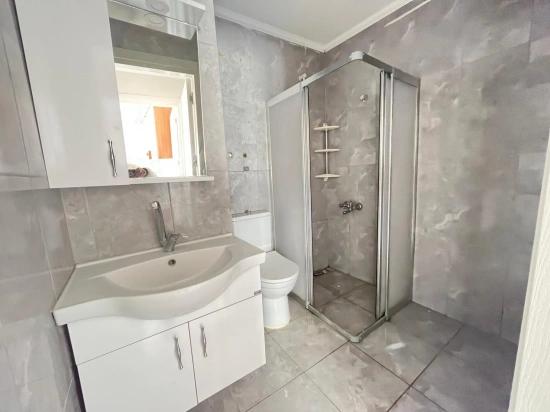 Large 2+1 Middle Floor Apartment For Sale In Ürkmez Center, Close To The Sea