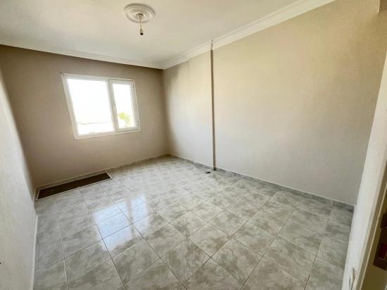 Large 2+1 Middle Floor Apartment For Sale In Ürkmez Center, Close To The Sea