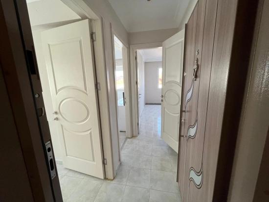 Large 2+1 Middle Floor Apartment For Sale In Ürkmez Center, Close To The Sea